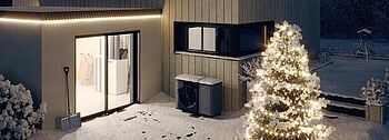 Wärmepumpe im Winter: So arbeitet sie effizient Wärmepumpe im Winter: Einfamilienhaus weihnachtlich geschmückt